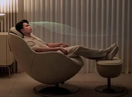 LG Massage Recliner holistic body and mind relaxation feature - woman enjoying relaxing massage